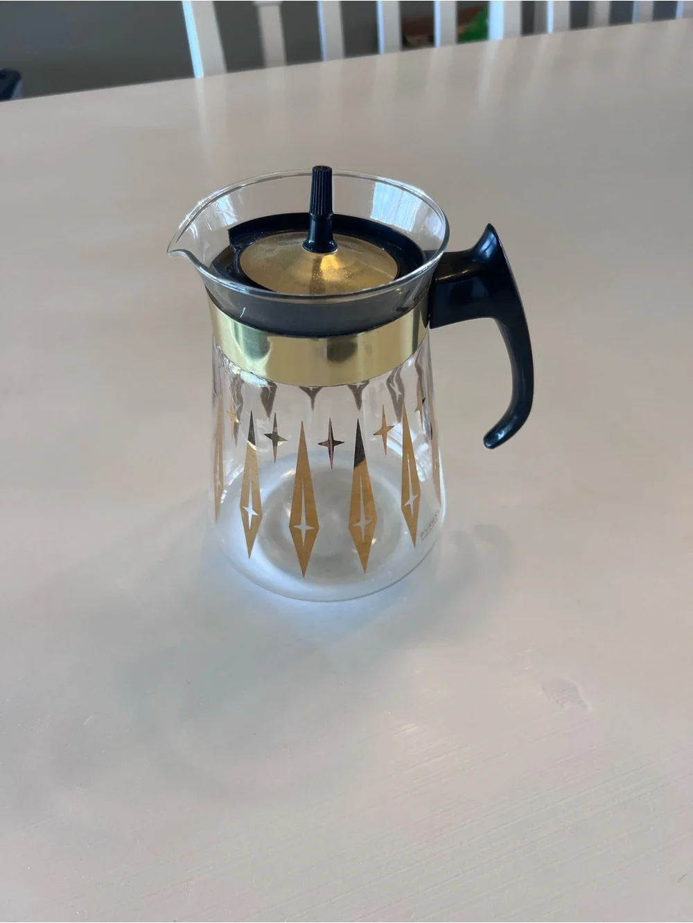 Pyrex Clear Glass Coffee Carafe with Gold Starburst Pattern and Black Handle